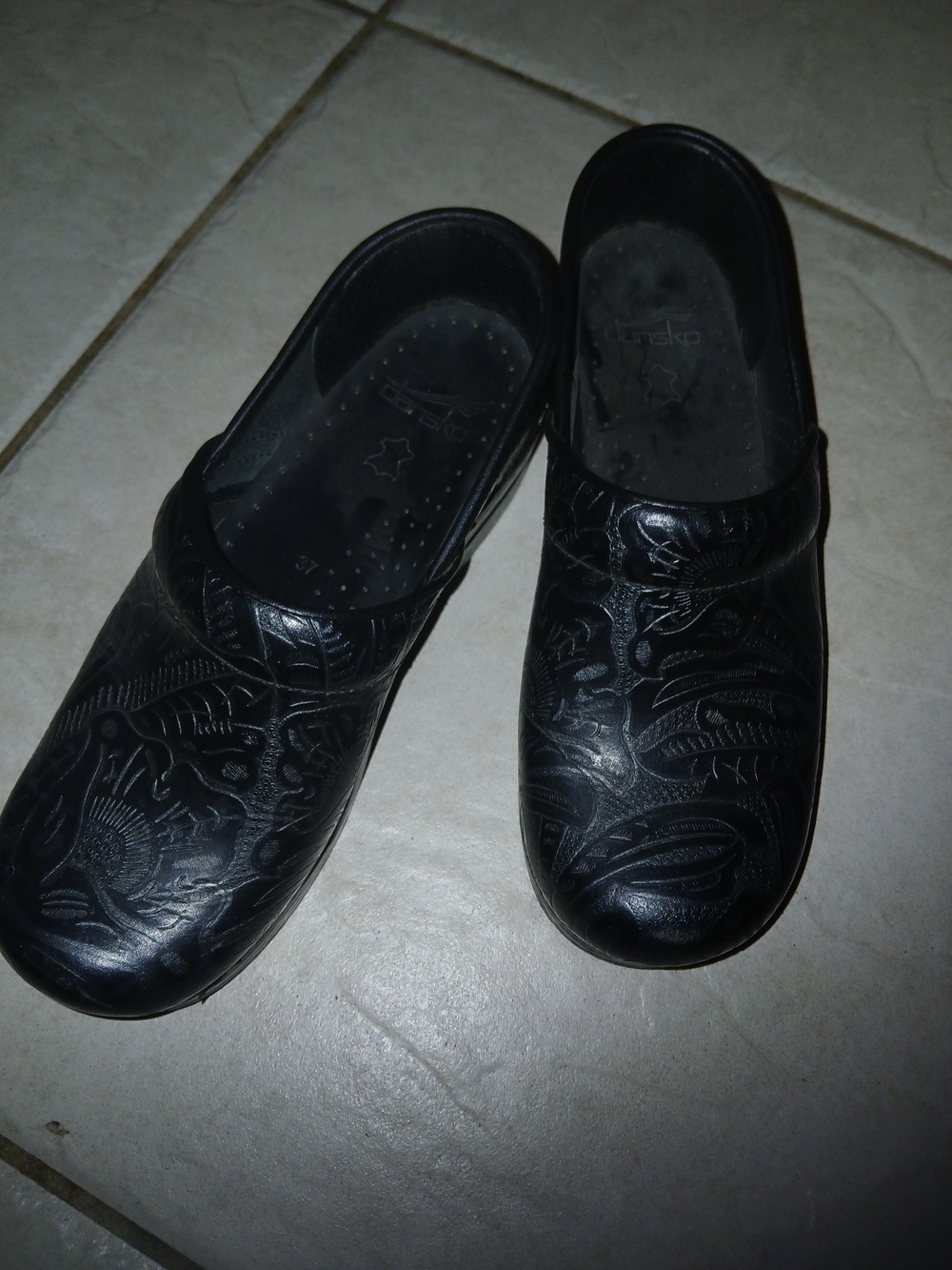 Dansko Black Embossed Floral Leather Clogs